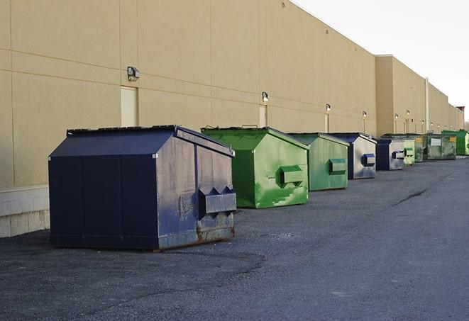 large construction waste containers in a row at a job site in Abilene